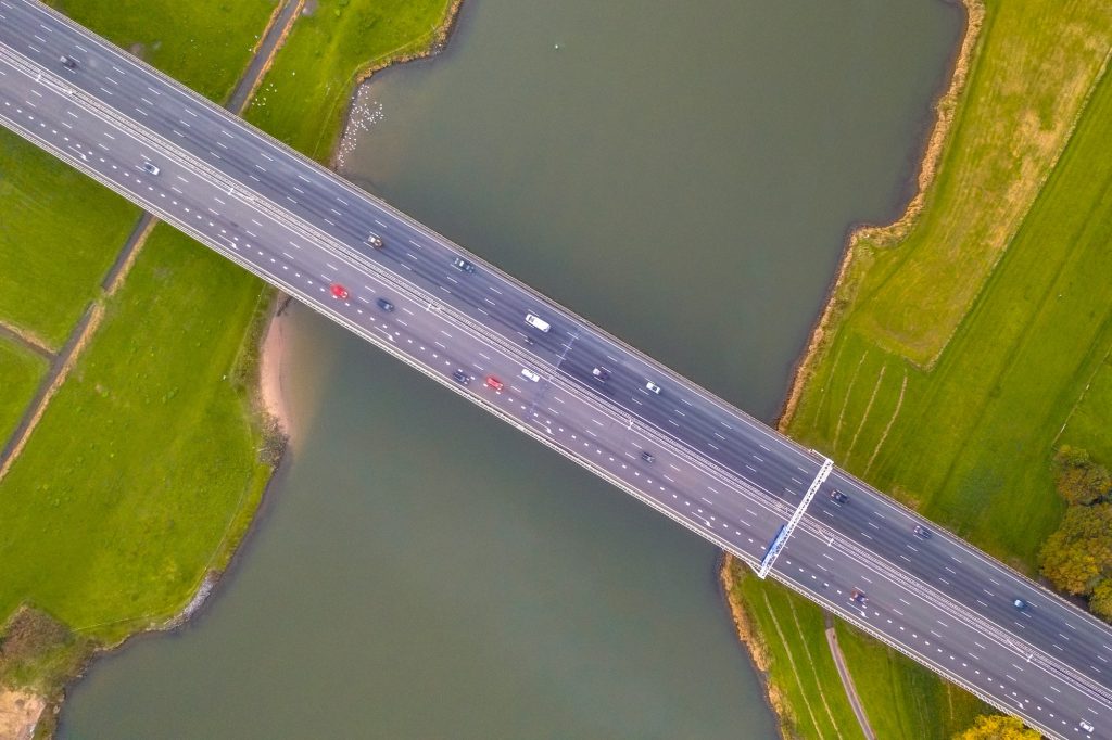 Lowland river IJssel with highway bridge